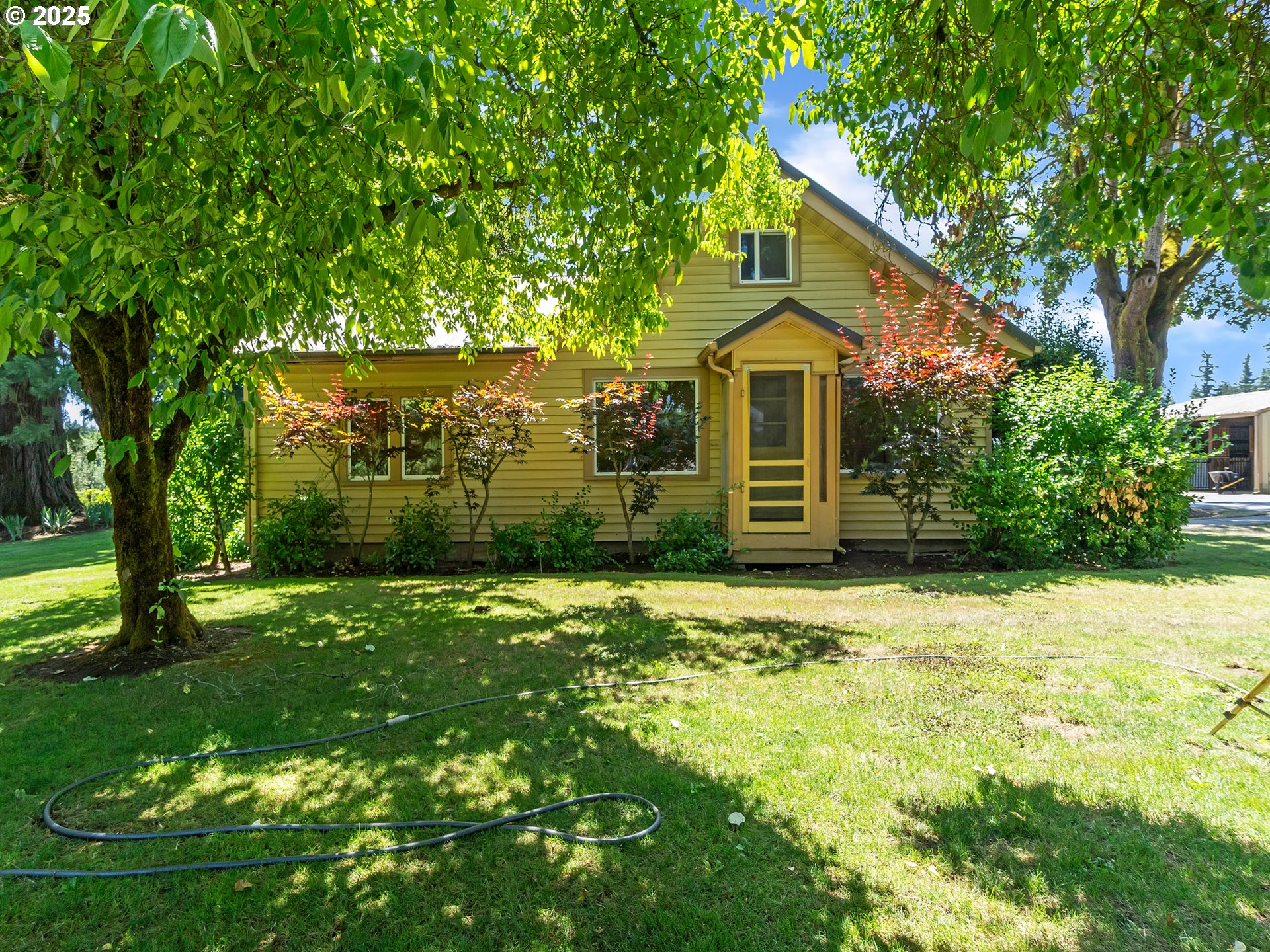13424 Ehlen Road Northeast Aurora, OR 97002 - Photo 44 of 48 a front view of a house with a yard