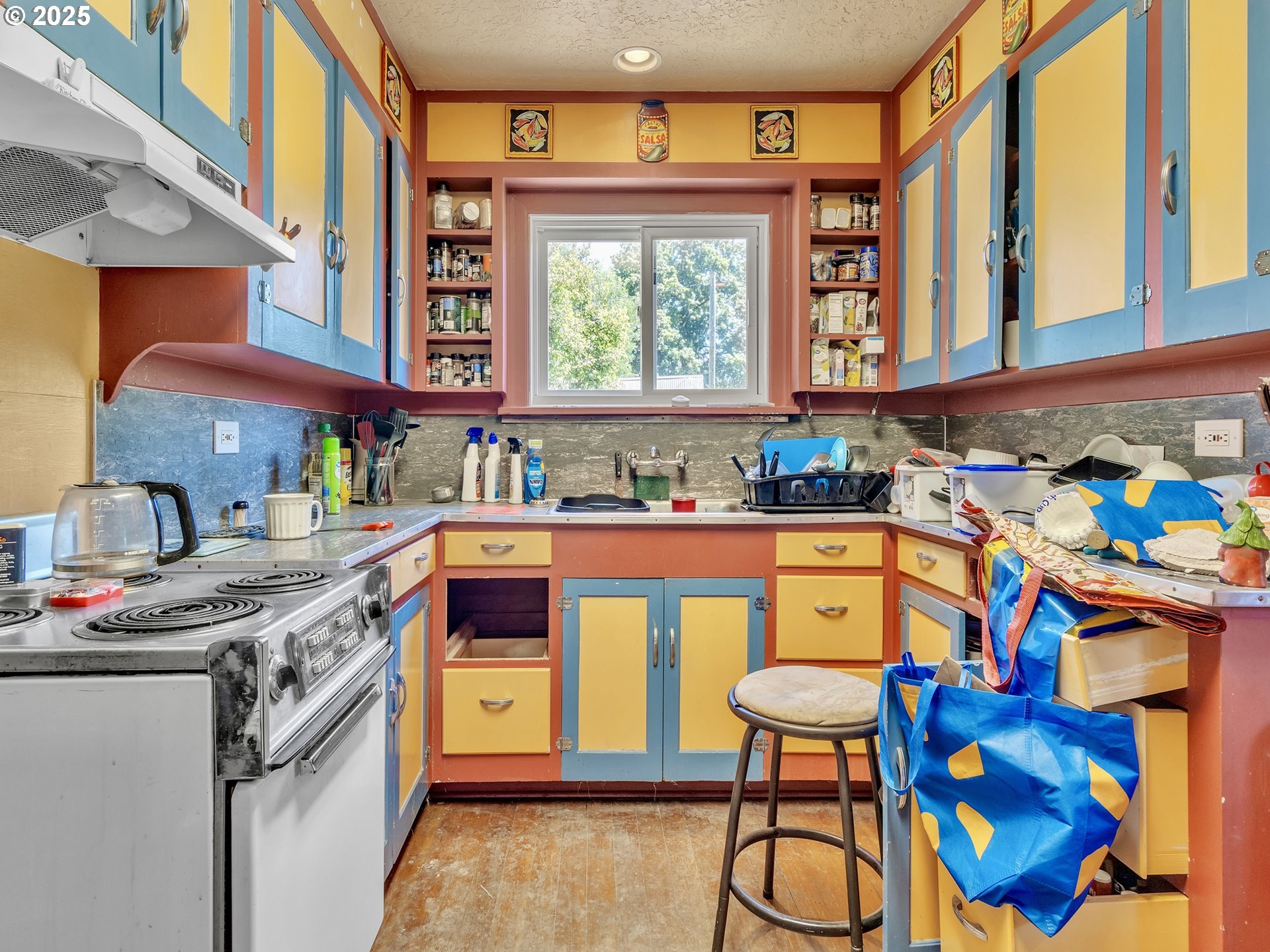 13424 Ehlen Road Northeast Aurora, OR 97002 - Photo 48 of 48 a kitchen that has a lot of cabinets in it and a window