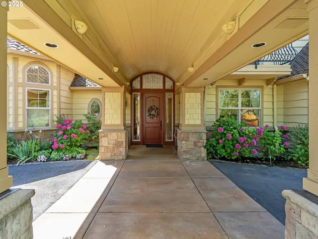a view of a house with a flower garden