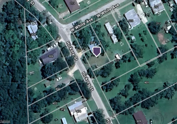 an aerial view of multiple houses with yard