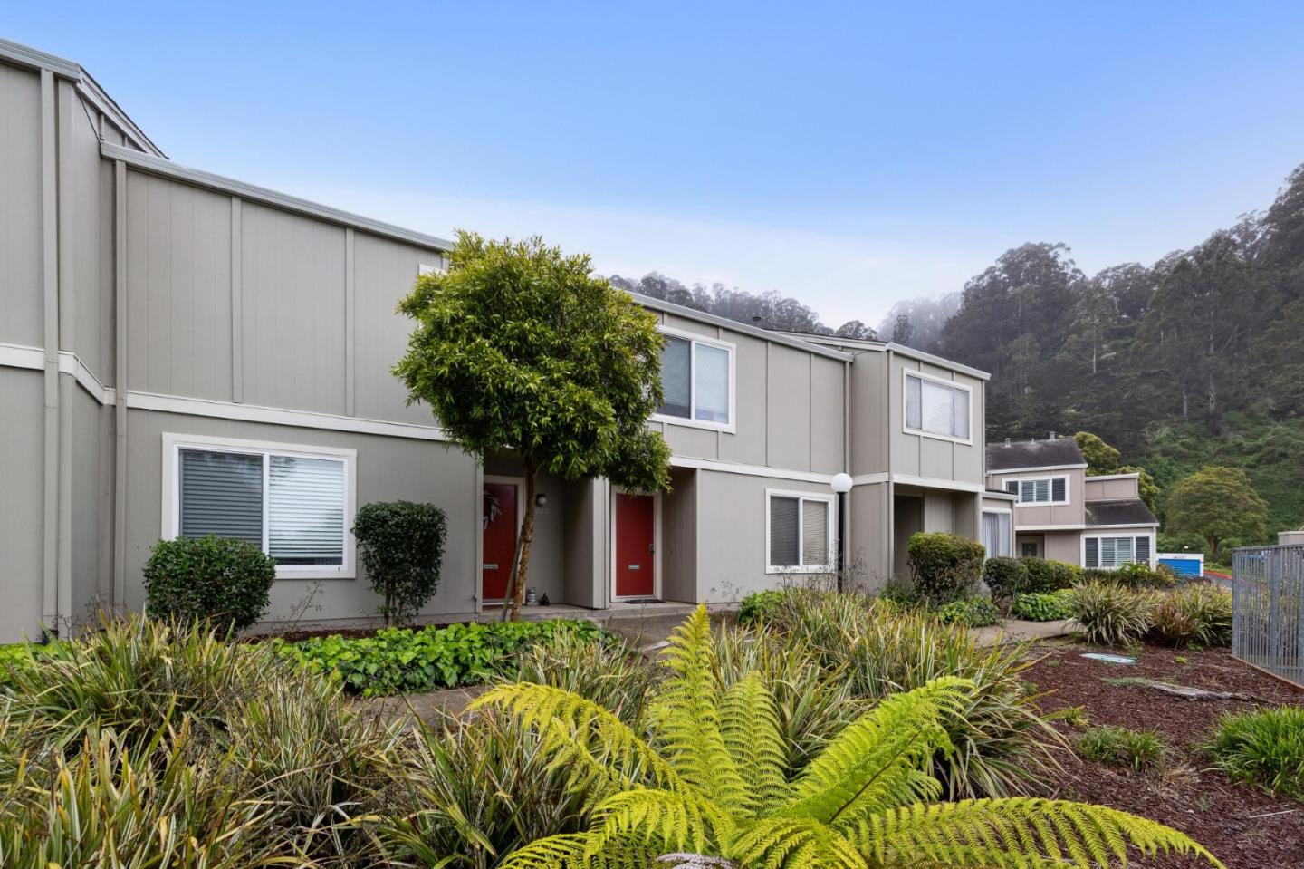 1287 Rosita Road Pacifica, CA 94044 - Photo 12 of 76 a front view of a house with garden
