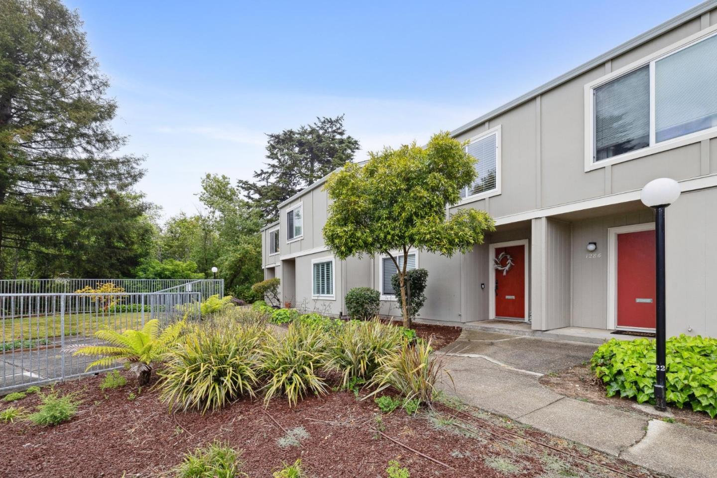 1287 Rosita Road Pacifica, CA 94044 - Photo 13 of 76 a front view of a house with garden