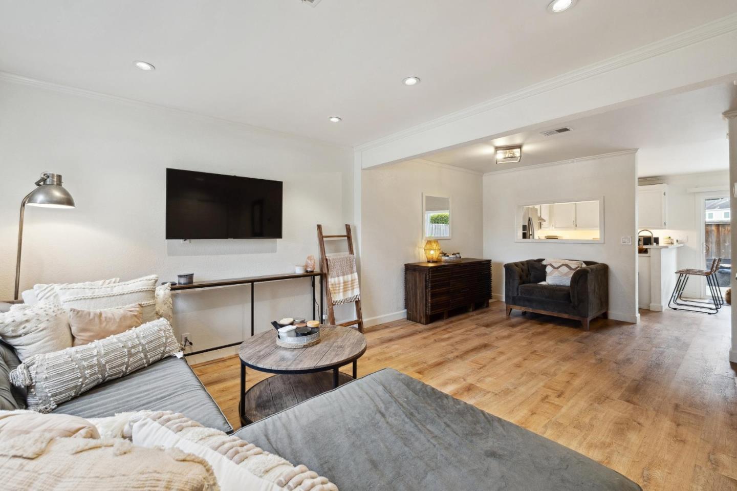1287 Rosita Road Pacifica, CA 94044 - Photo 16 of 76 a living room with furniture and a flat screen tv