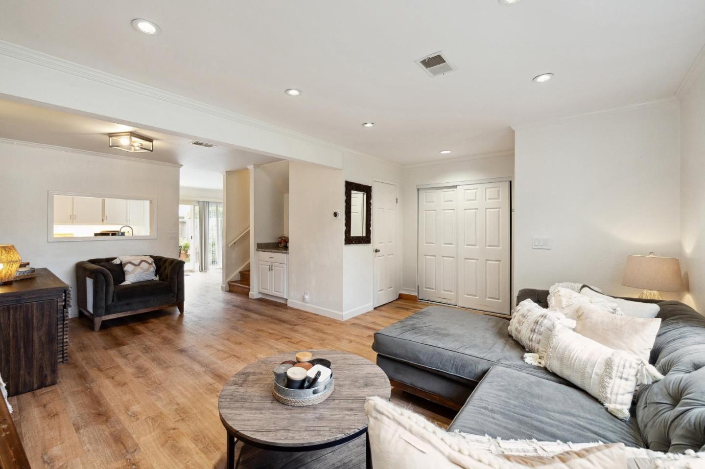 1287 Rosita Road Pacifica, CA 94044 - Photo 17 of 76 a living room with furniture and wooden floor