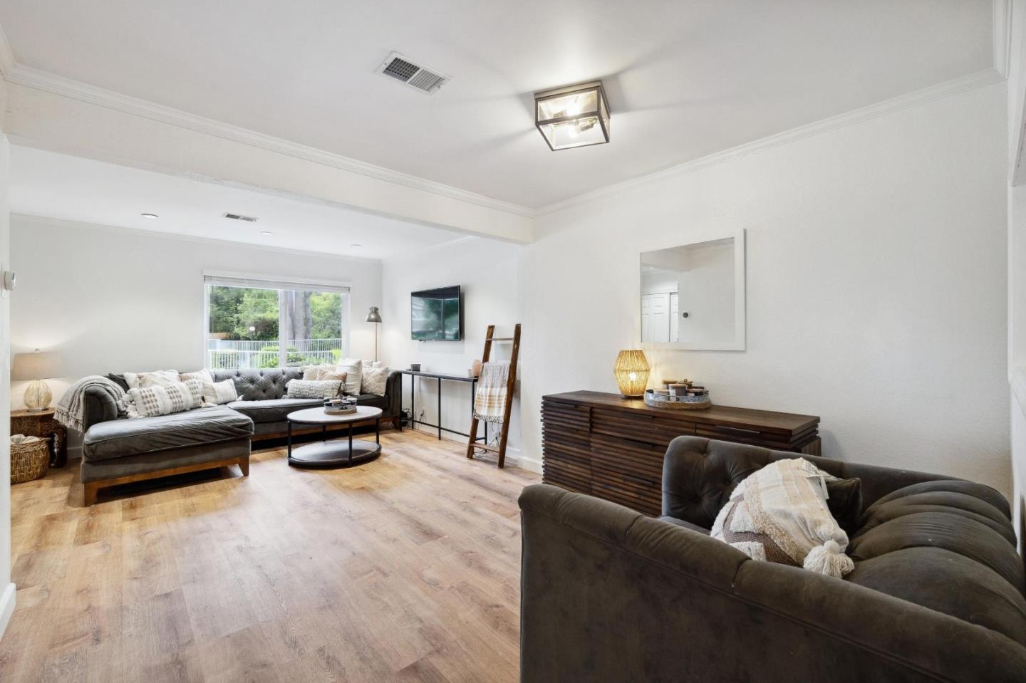 1287 Rosita Road Pacifica, CA 94044 - Photo 21 of 76 a living room with furniture and a couch