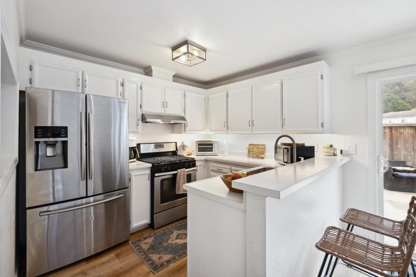 1287 Rosita Road Pacifica, CA 94044 - Photo 27 of 76 a kitchen with stainless steel appliances granite countertop a refrigerator sink and stove