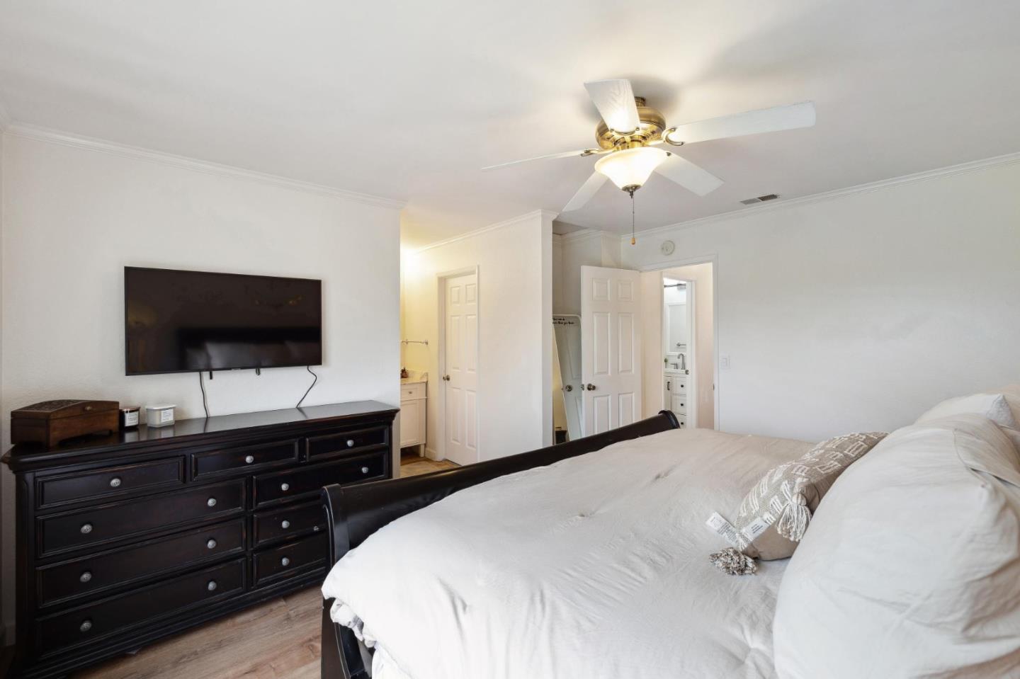 1287 Rosita Road Pacifica, CA 94044 - Photo 37 of 76 a bedroom with a bed and a flat screen tv