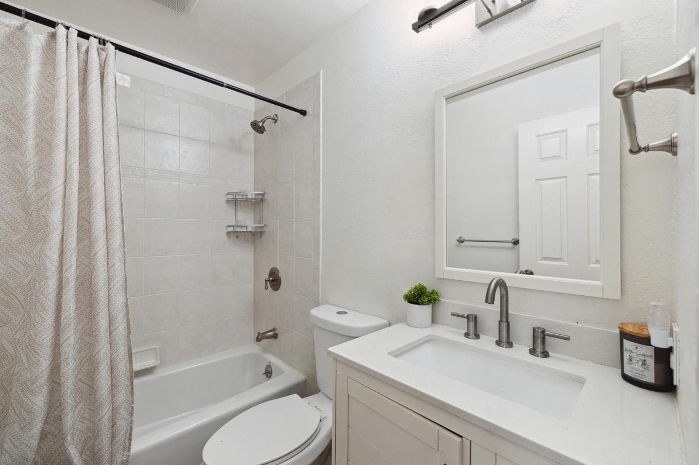 1287 Rosita Road Pacifica, CA 94044 - Photo 42 of 76 a bathroom with a granite countertop sink toilet and shower