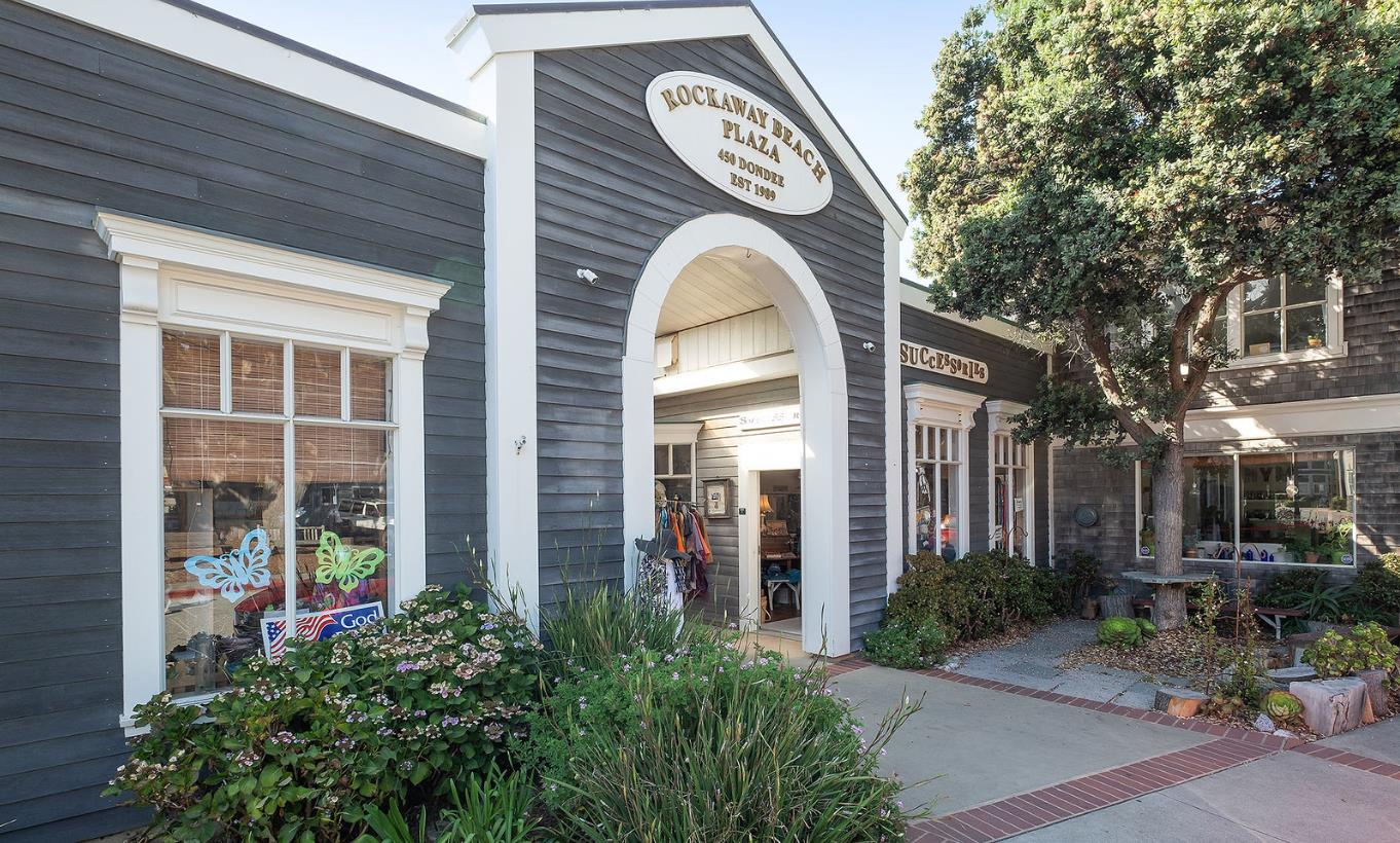 1287 Rosita Road Pacifica, CA 94044 - Photo 62 of 76 a view of a brick house with a clock and a clock on the wall