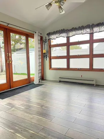 a view of an empty room with a window