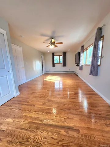 a view of a livingroom with a kitchen