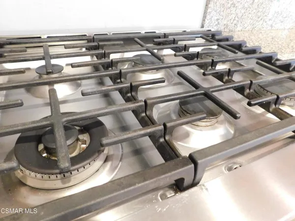 a view of a kitchen with a sink and a stove