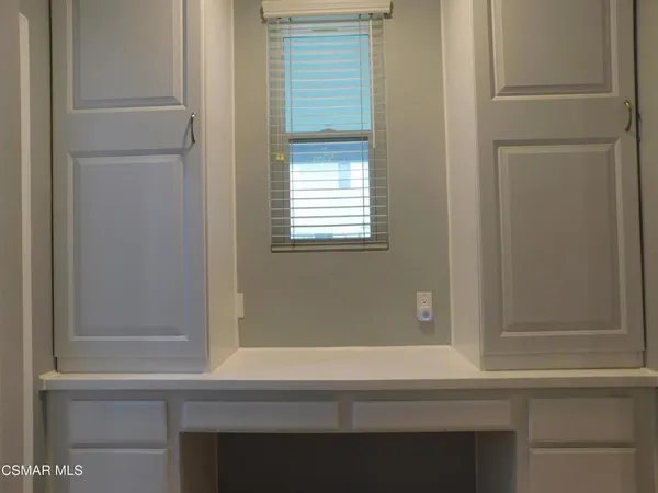 a bathroom with a bathtub and next to a window