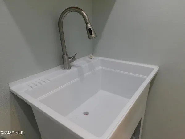 a front view of house with yard and outdoor seating