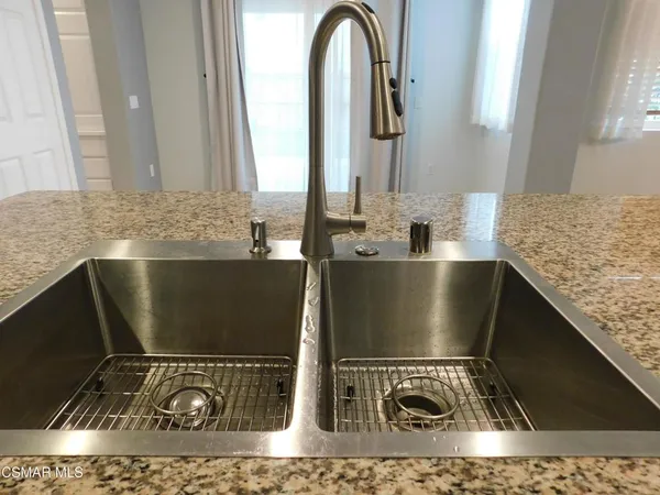 a view of a sink and a mirror