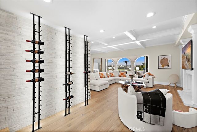 a living room with furniture fireplace and wooden floor