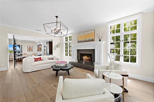 a kitchen with stainless steel appliances a table chairs and white cabinets