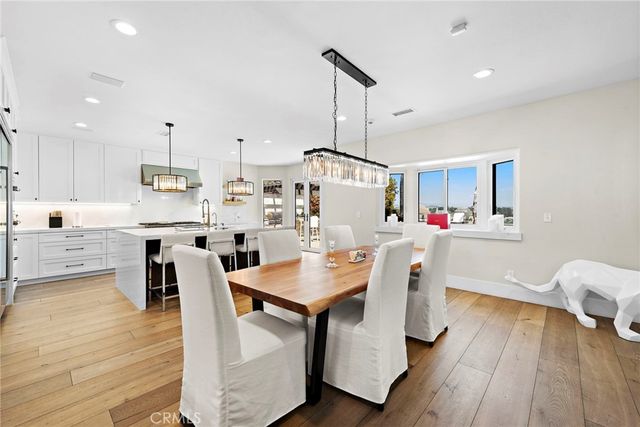 a spacious bedroom with a large bed and windows