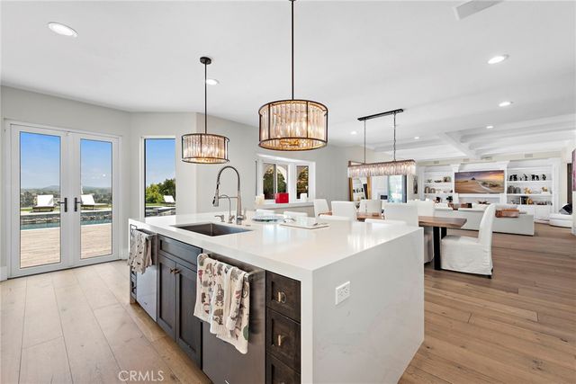 a view of a lake with a table and chairs
