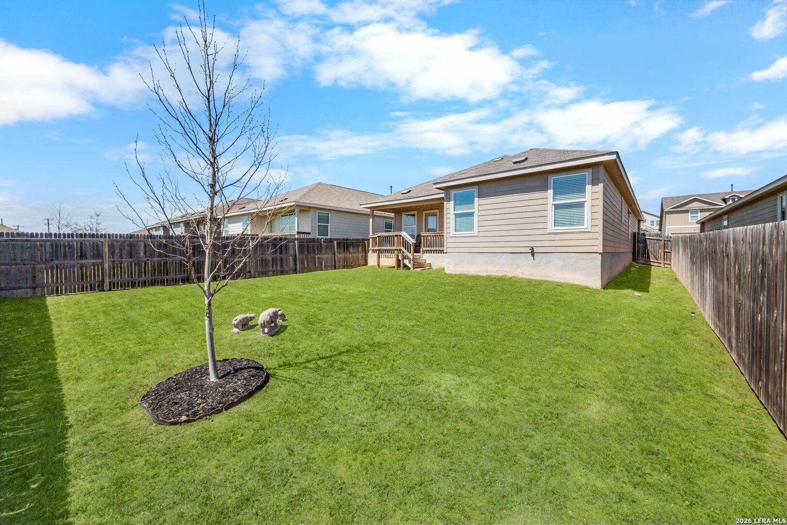 5781 Companion Loop Bulverde, TX 78163 - Photo 20 of 21 a view of a house with backyard and a tree