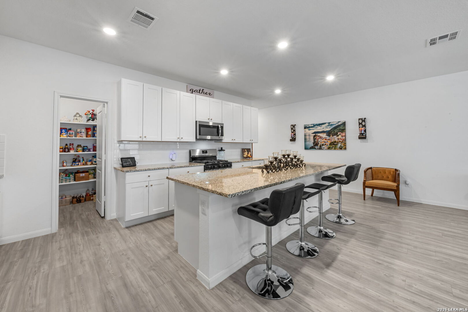 5781 Companion Loop Bulverde, TX 78163 - Photo 6 of 21 a kitchen with a sink appliances and cabinets