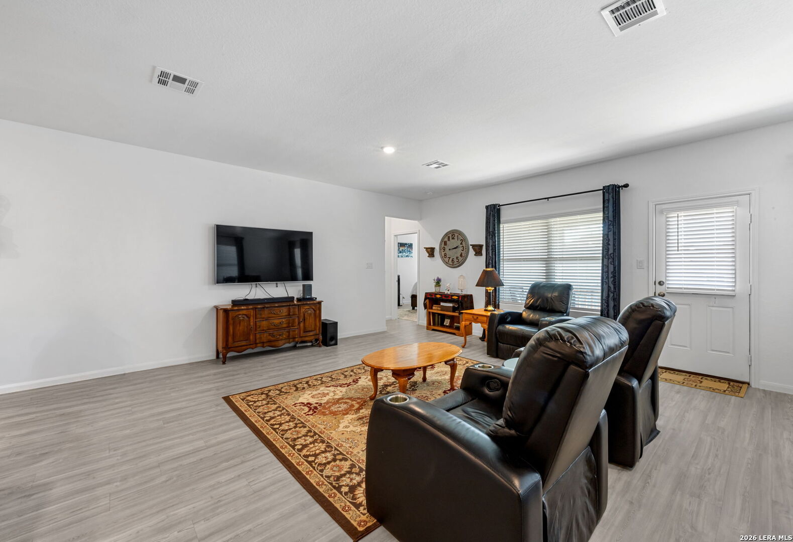 5781 Companion Loop Bulverde, TX 78163 - Photo 8 of 21 a living room with furniture and a flat screen tv