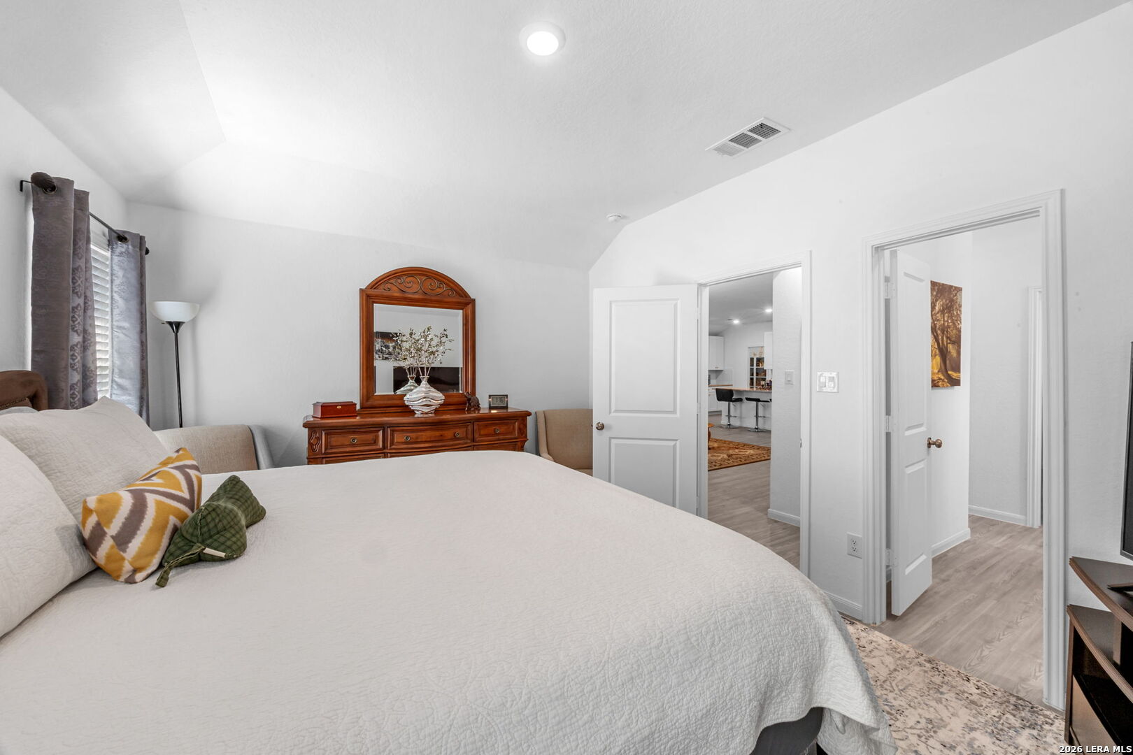 5781 Companion Loop Bulverde, TX 78163 - Photo 10 of 21 a bedroom with a bed and a lamp