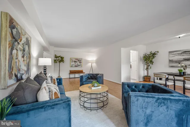 a living room with furniture and a table