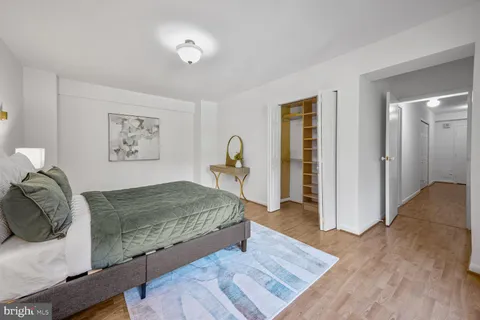 a bedroom with a bed and a walk in closet