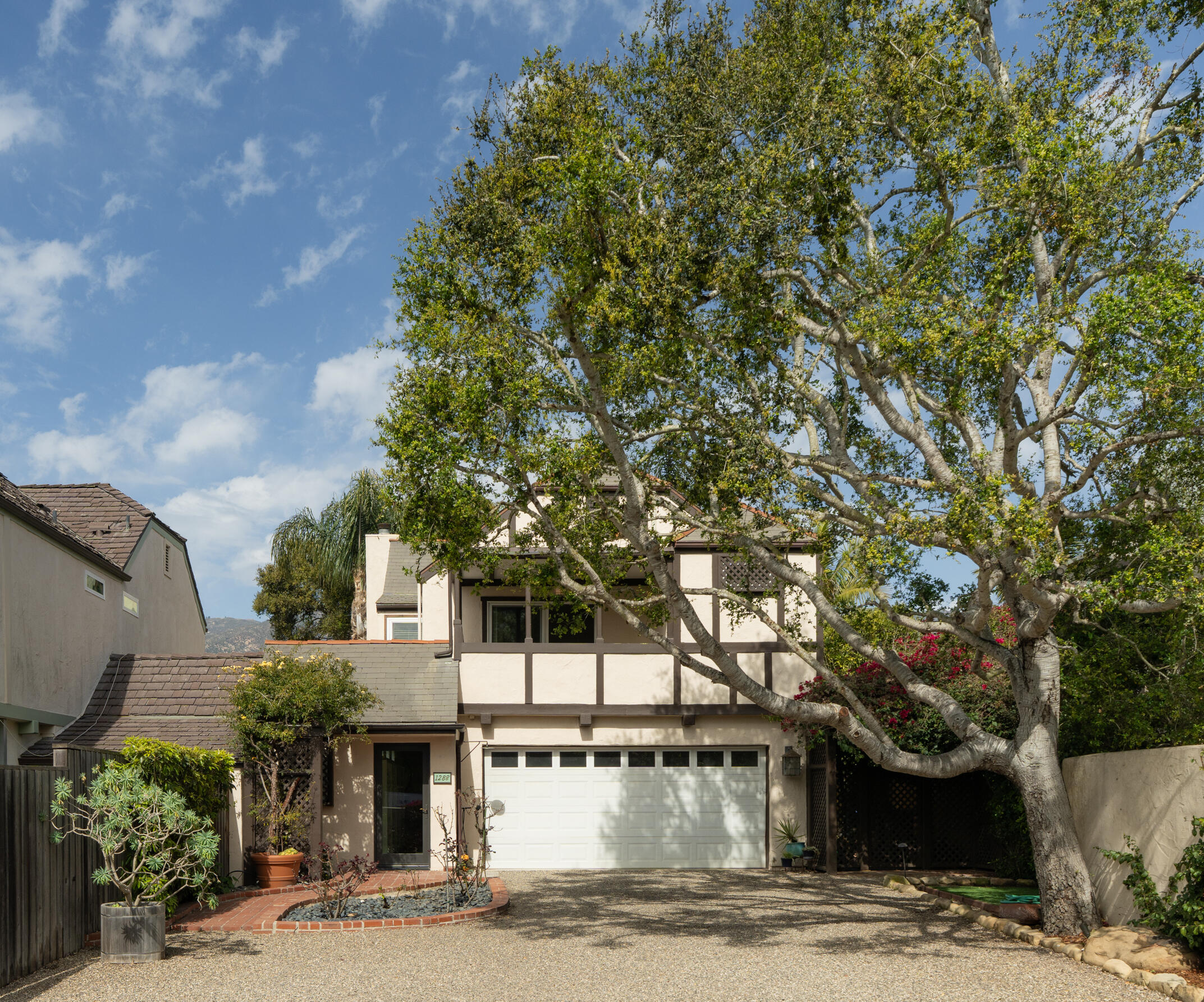 1288 Spring Road Santa Barbara, CA 93108 - Photo 1 of 16 a front view of a house with a garden