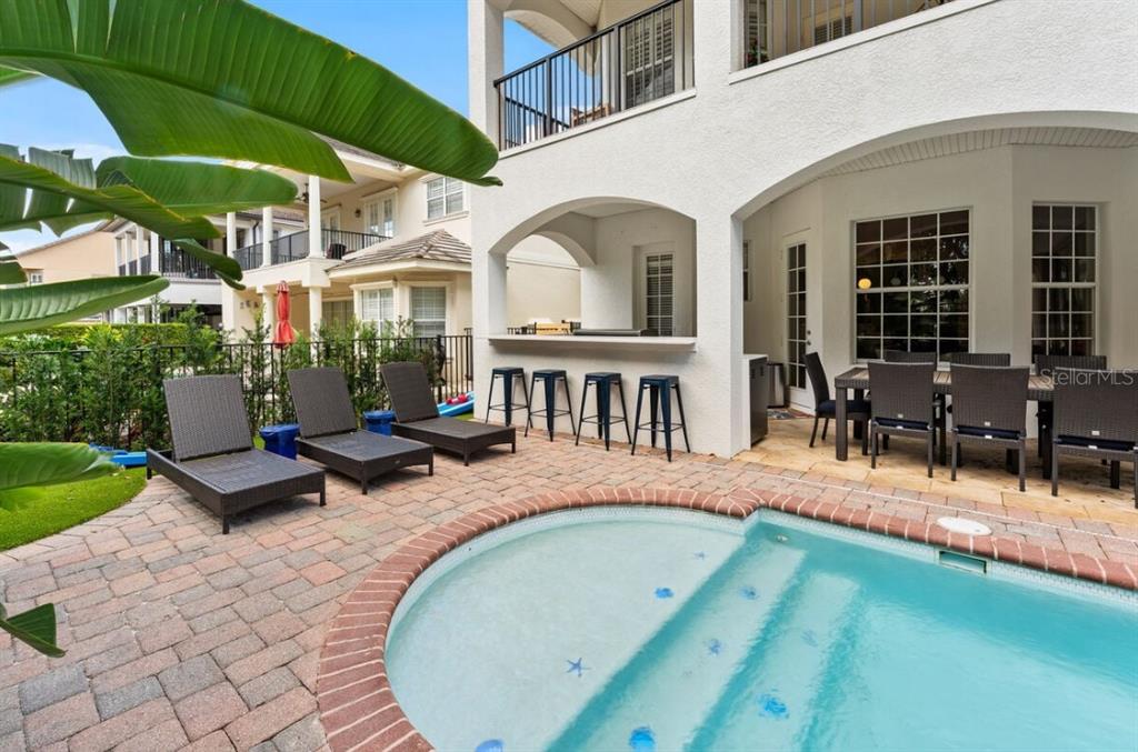 1227 Radiant Street Reunion, FL 34747 - Photo 14 of 70 a view of a house with backyard porch and sitting area