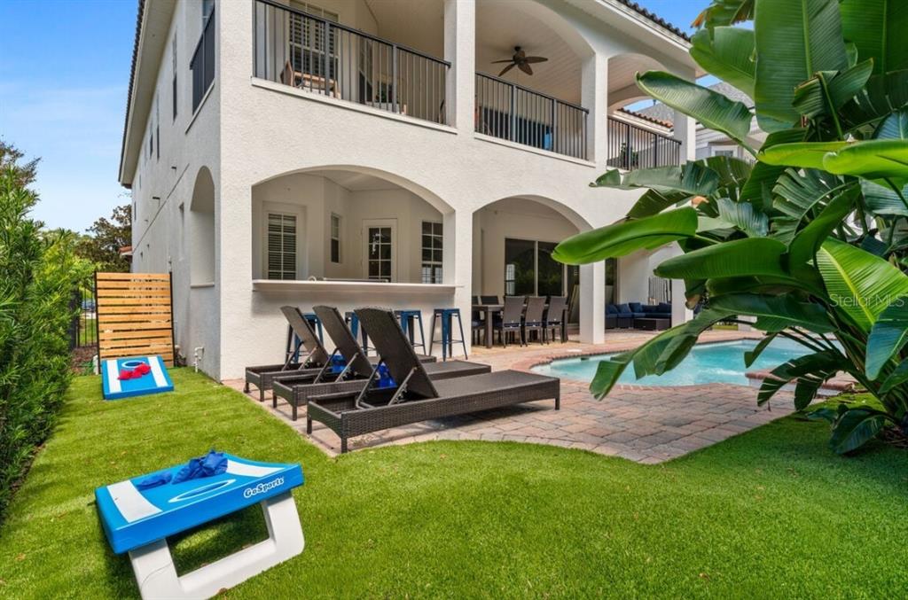 1227 Radiant Street Reunion, FL 34747 - Photo 19 of 70 a view of a backyard with sitting area and furniture