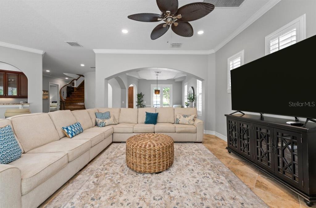 1227 Radiant Street Reunion, FL 34747 - Photo 22 of 70 a living room with furniture and a flat screen tv