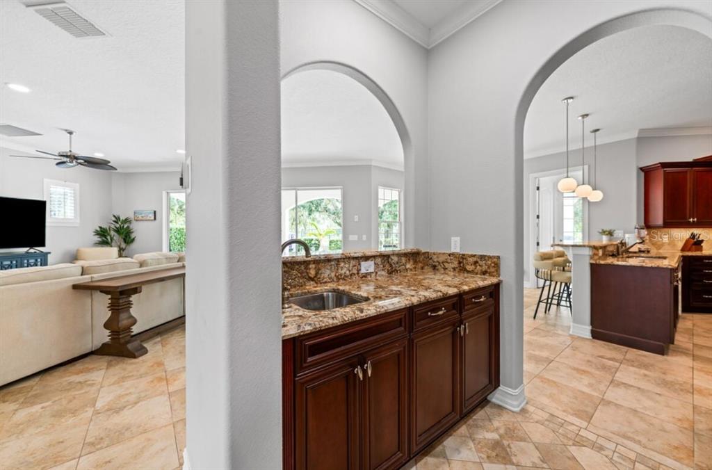 1227 Radiant Street Reunion, FL 34747 - Photo 28 of 70 a kitchen with a stove and a sink