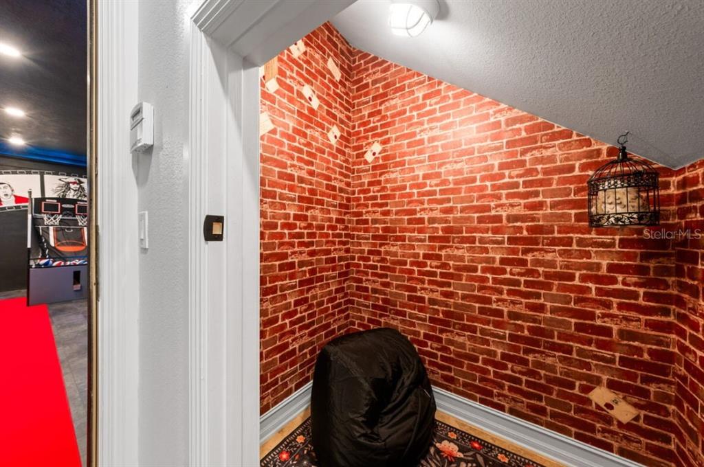 1227 Radiant Street Reunion, FL 34747 - Photo 32 of 70 a bathroom with a toilet and a shower curtain