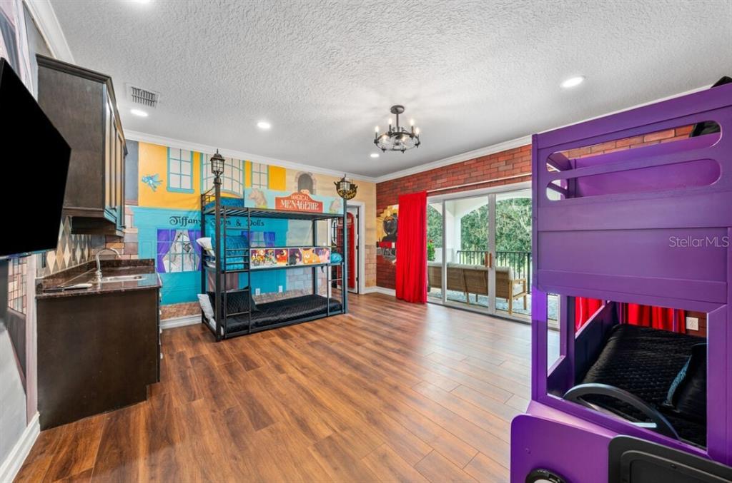 1227 Radiant Street Reunion, FL 34747 - Photo 42 of 70 a living room with furniture windows and a flat screen tv