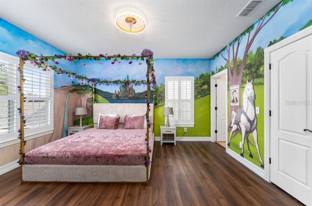 1227 Radiant Street Reunion, FL 34747 - Photo 45 of 70 a bedroom with a bed dresser and a window