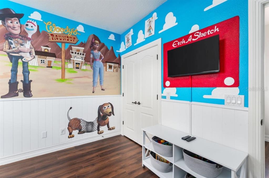 1227 Radiant Street Reunion, FL 34747 - Photo 49 of 70 a view of a room with gym equipment