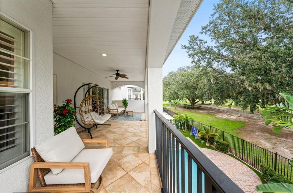 1227 Radiant Street Reunion, FL 34747 - Photo 63 of 70 a view of a balcony with wooden floor