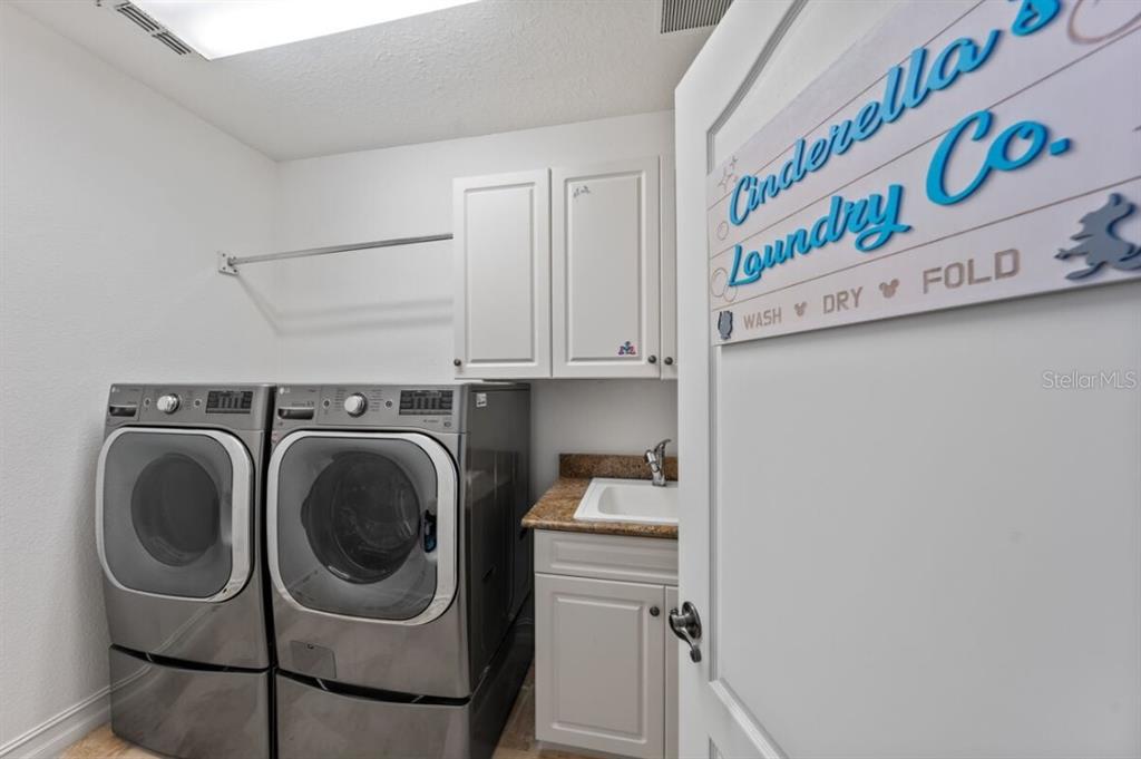 1227 Radiant Street Reunion, FL 34747 - Photo 65 of 70 a utility room with dryer and washer
