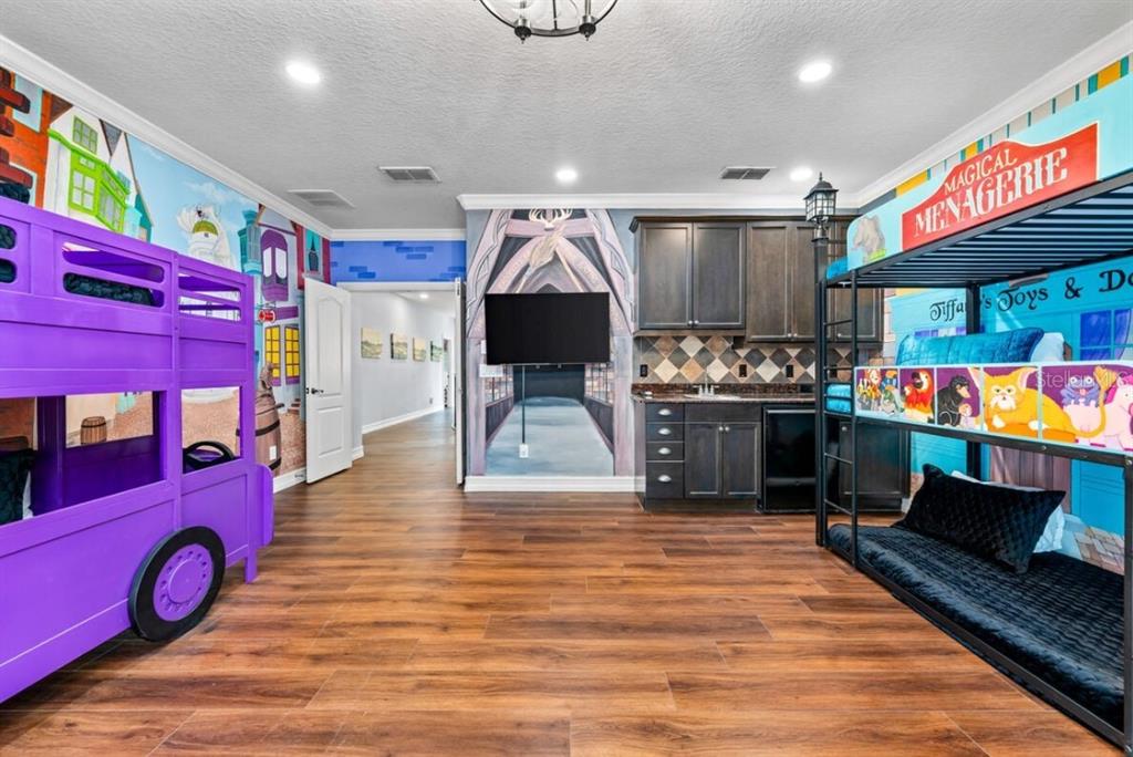 1227 Radiant Street Reunion, FL 34747 - Photo 8 of 70 a room with lots of furniture and screen view