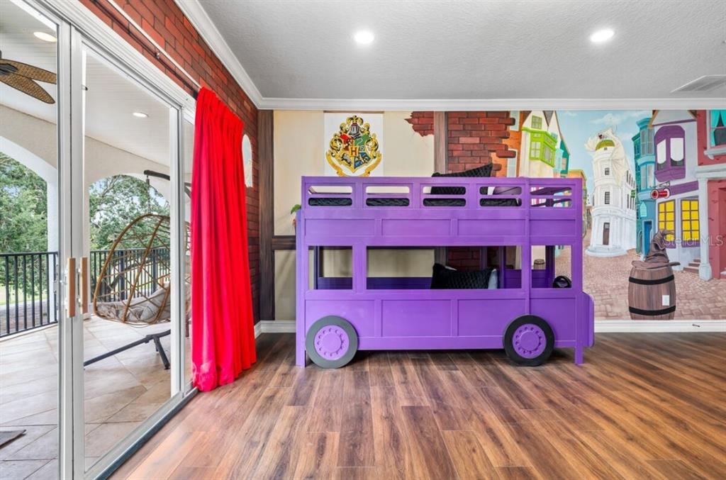 1227 Radiant Street Reunion, FL 34747 - Photo 9 of 70 a view of a room with gym equipment