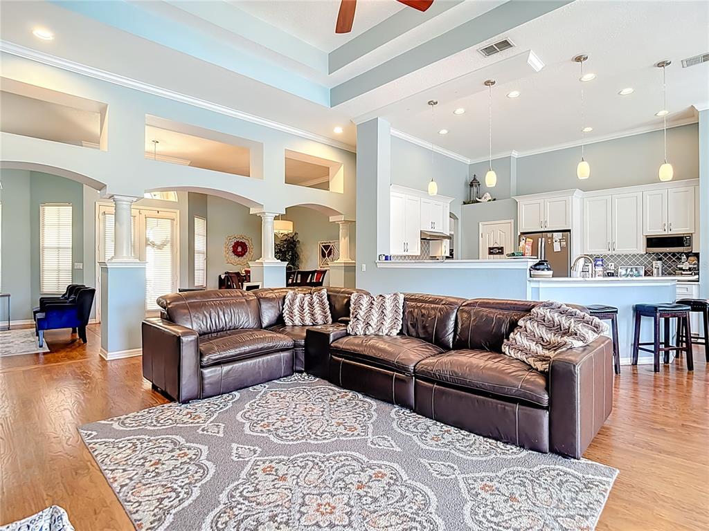 4805 Tea Rose Court Lutz, FL 33558 - Photo 15 of 59 a living room with furniture and kitchen view