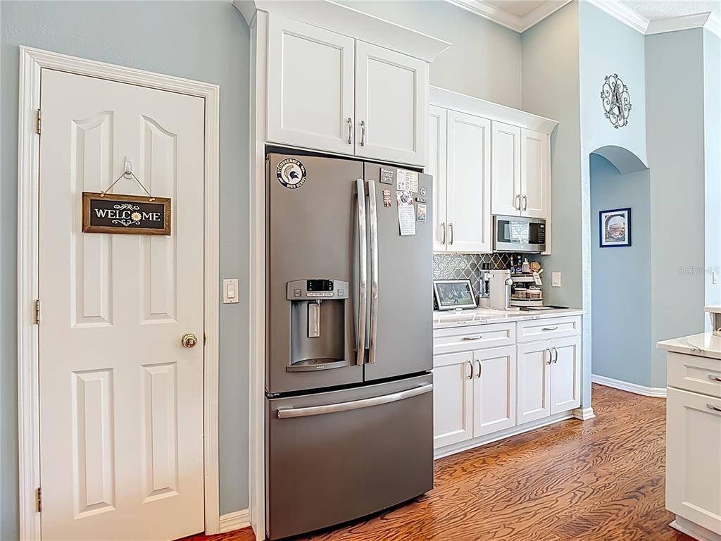 4805 Tea Rose Court Lutz, FL 33558 - Photo 21 of 59 a kitchen with stainless steel appliances granite countertop a refrigerator and a stove