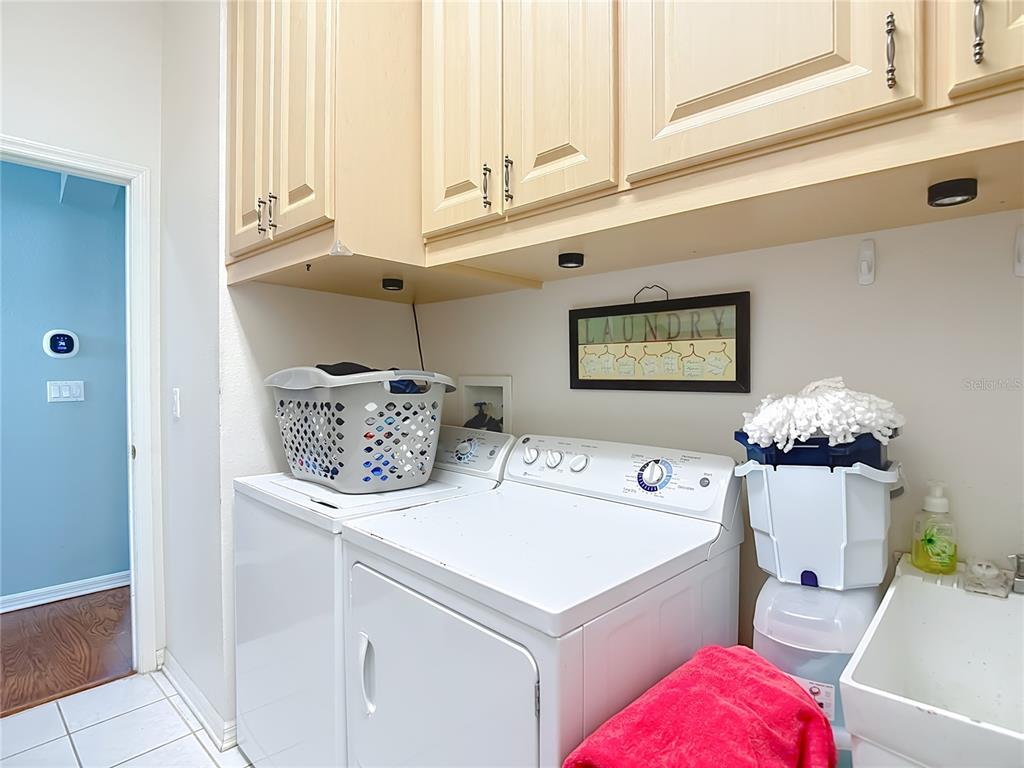 4805 Tea Rose Court Lutz, FL 33558 - Photo 40 of 59 a utility room with dryer and washer