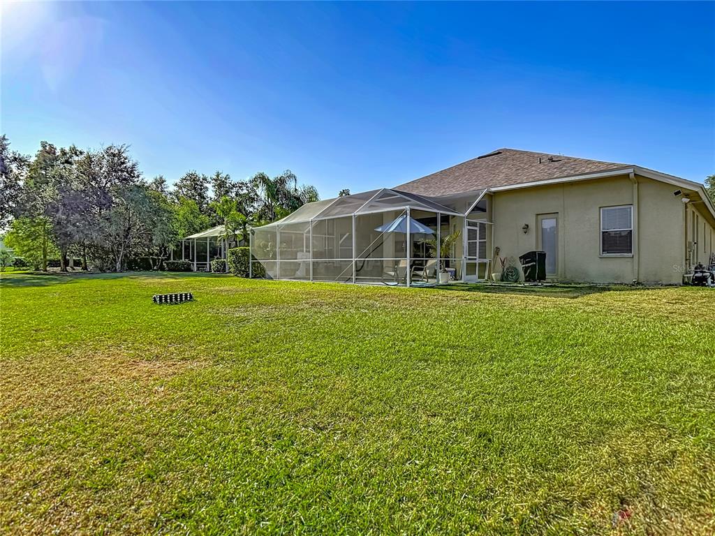 4805 Tea Rose Court Lutz, FL 33558 - Photo 49 of 59 a front view of a house with a yard