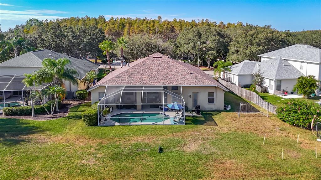 4805 Tea Rose Court Lutz, FL 33558 - Photo 50 of 59 a view of a house with a yard balcony and sitting area