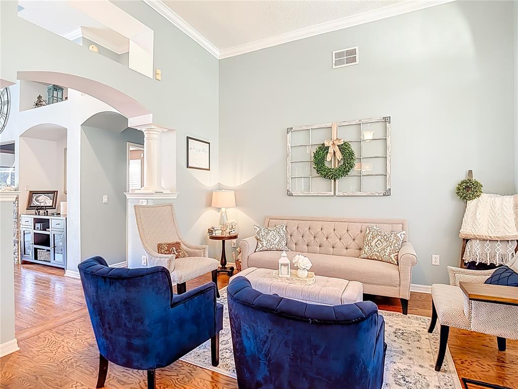 4805 Tea Rose Court Lutz, FL 33558 - Photo 10 of 59 a living room with furniture and wooden floor