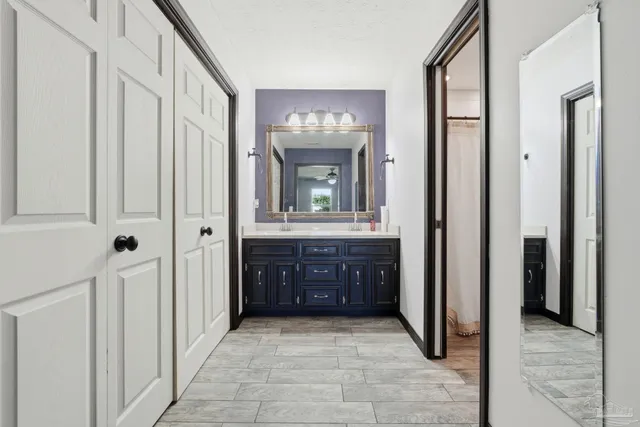 a bathroom with a sink and a mirror