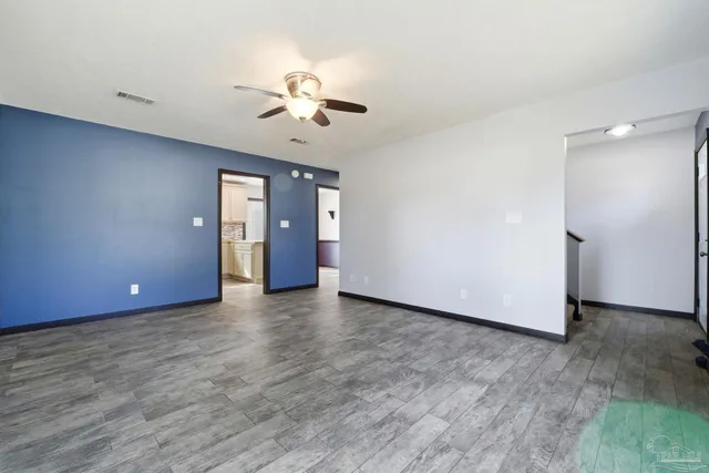 a view of an empty room with a window